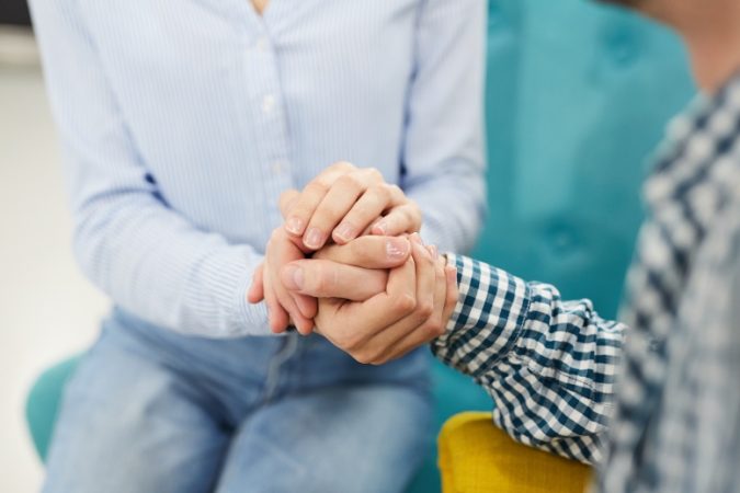 Close up of two people holding hands in  therapy session or support group, copy space SSUCv3H4sIAAAAAAAEAJ1VyW7bOhTdP+D9Q8B1CHDmZb+gy266KrrgcBULkSVDQx+CIv/+KFuyKNtpgO7Ec+fp6Pe//zw9keCHOpIvT7/nV37XTTMNY+/HumszzJ4XvMc2YV8imOqx62vflGDwYzy0/ogZbKemmeH3s5AMox+nAYcimG/88S2/5WruUxdwGLv4WqKhfjljp0M3dqUg+vaxIPXoj8NYn/O4osNhGkfs7/xzIfuqBE5dm/QMFOlHP+JLrndXwNq9H5f30ypYshuziJDnAhumcMZW6P35ry0vHz+vrXvBNr5tud3X+6PwZne+uby6/XnF98MojTkTWj+y2LW9tHDiJp57ZH4759LDV/TNeNh5+YbdqcGHmS97tUsBBRfKWyocj1QBE9RFHqhisQrOgPIu7dzLaAyAD7SyMRvEilEwBqnjPEtQsFCxLfjl471YmB4b9Jd9X/IgRtkUBONUO6OoSjJS4DkCWq2NdQjSVOQ6UB9lCHOayXKqMKqcMFQUoUK0IjKV8KoMPL+9DlQYxajiIZvp6CnmEjWHaNGGq7KNwbMAilYsZWXNE3WAkRpvQgSspIXNczIpQAoVjXnqVEkZaEBtqRYxMuO81VvfiJaKmypnWvlkqaqkp847oAakVxVTzKE/9+wyLPL6X97P4/milq75KdVdcWG/uuib4eYWT30d6/alMOvGw5mdVrPYTe3Yv5VXRJquO/nQzLtZZZ+44gc/DFk9rXh59JkLu2MRp+3G80QXryRlVpifXHLnQDDllGLAtAOysl5e6DrtWK+8KyIM44ZpUOQDmiLfuZbGiLw3bptKeWmEKyWkdgyu8ttTIsIpxoSVW5iV9ciAv7Ad36pu6q3iLk+Jabbp3ZIsMcCs5Vxvm7qcGzFYpaQiUM8jUiUgUGAq0uRNTFVejMC3/V5JNtOJ4WCUMOTub3Goc+i+YDUynZrOJ0w7ott1lGutDAjh2AfEtChIZjaF2yJXHQ73rLLIlCnsb2a2qGgFH7PbRUcqqTaddSYXmeGMb7K1X7PMWZNHsHDOdW+mcKxzFp/3xln7Seoyr9Of2ueEkOKT2tys9kFtDqTjf26/5cCNeNx+B9oy+bA3mYIMt/qej+u5LyRknvVGGRqkhEyUgmcKxkxnFkQ0EgPA/Et5/x+5rj7KHgkAAA==